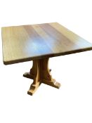 Knightman Yorkshire oak centre table on crucifix pedestal base, 77cm by 101cm by 90.5cm.