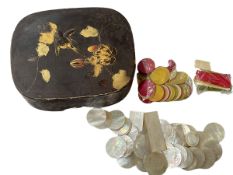 Oriental lacquered box together with collection of mostly mother of pearl counters.