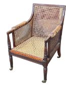 George IV mahogany bergere panelled library chair.