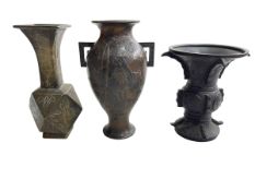 Three small Chinese and Japanese bronze vases.