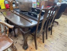 Early 20th Century oak extending dining table on heavy ball and claw legs together with two leaves