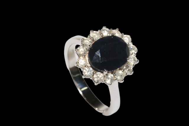 Sapphire and diamond cluster ring set in 18 carat white gold, the oval sapphire 3. - Image 3 of 3