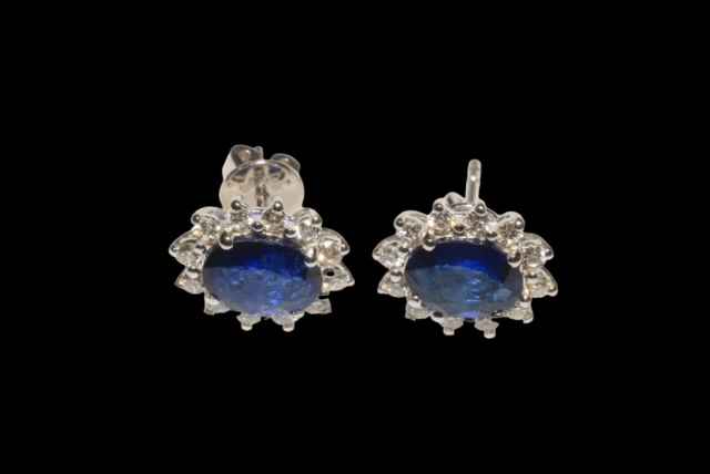 Pair of 18 carat white gold, sapphire and diamond cluster earrings,