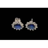 Pair of 18 carat white gold, sapphire and diamond cluster earrings,