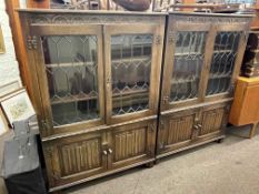Pair oak leaded glazed four door cabinet bookcases, 136cm by 94.5cm by 32.5cm.