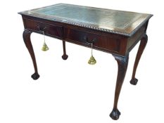 Mahogany Chippendale style two drawer writing table on ball and claw legs, 77cm by 107cm by 61cm.