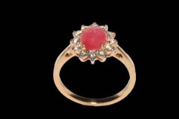 18 carat yellow gold, ruby and diamond cluster ring, the oval ruby surrounded by twelve diamonds,