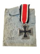 German WWII Iron Cross with ribbon in original paper bag.