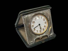 Silver mounted travel clock, Birmingham 1912, case 10cm by 10cm.