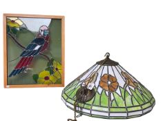 Stained glass light shade and a parrot stained glass panel.