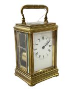 Gilt brass carriage clock with striking movement.