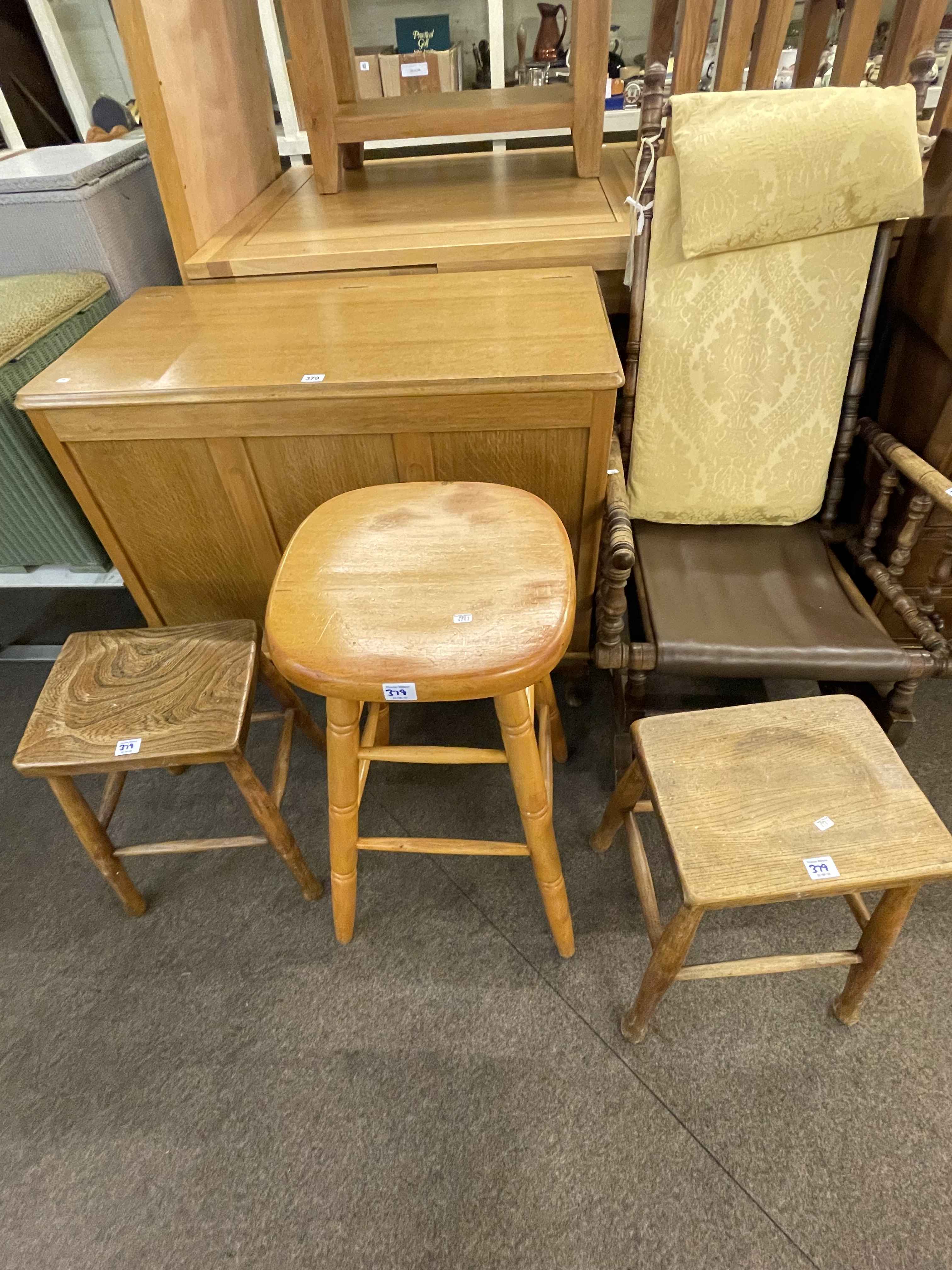 Light oak blanket box, American rocker and three stools (5).