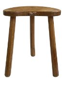 Robert Thompson of Kilburn 'Mouseman' kidney shaped milking stool, 45.5cm by 36.5cm by 29cm.