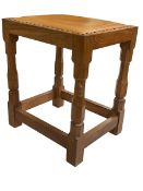 Robert Thompson of Kilburn 'Mouseman' adzed oak leather topped stool, 45.5cm by 39cm by 31cm.