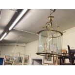 Two five branch glazed panel ceiling lights.