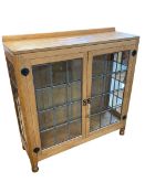 Robert Thompson of Kilburn 'Mouseman' adzed oak double leaded glazed door display cabinet,