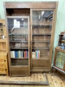 Large Continental glazed two door bookcase with six adjustable shelves, 231cm by 161cm by 40cm.