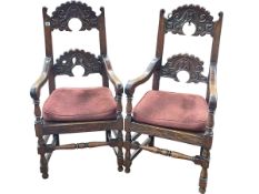 Pair carved oak elbow chairs.