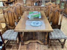 Titchmarsh & Goodwin style oak nine piece dining suite comprising four fielded panel door sideboard,