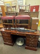 Mahogany nine drawer pedestal desk and pair antique oak side chairs, desk 77cm by 145cm by 66cm.