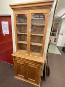 Victorian stripped pine glazed door top cabinet bookcase, 205cm by 86cm by 41cm.