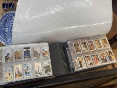 Five albums of cigarette cards.