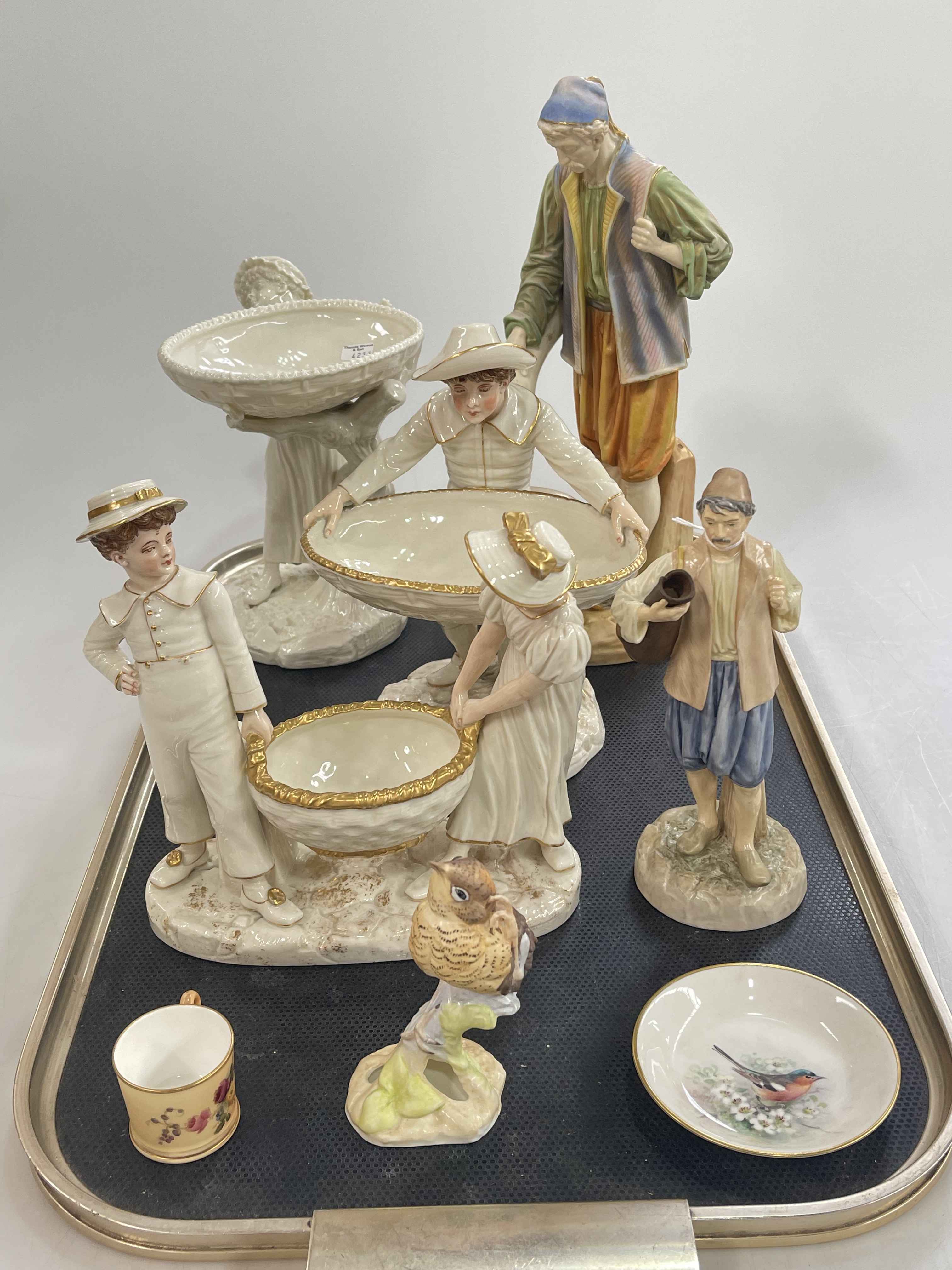 Eight pieces of Royal Worcester including figurines, miniature cup, bird and pin dish.