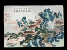 Chinese porcelain plaque in famille verte with pagodas in extensive landscape and calligraphy,