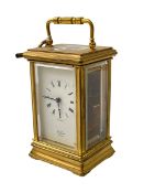 Gilt brass carriage clock with key, St. James, London.