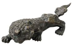 Japanese bronze recumbent dog of foo, 38cm length.