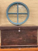 Painted Victorian trunk and circular window.