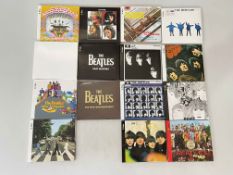 The Beatles 13 studio album CD's in box.