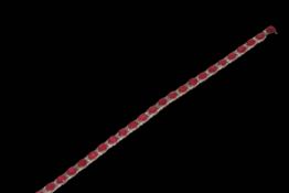 18 carat white gold, ruby and diamond bracelet containing 26 oval rubies 9.