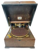 Oak cased over sized table top gramophone, possibly EMG (lacking horn) and spare needle heads.