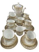 Minton Jubilee Gold and white tea service, 36 pieces.