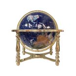 Semi-precious stone globe on brass stand, 43cm high.