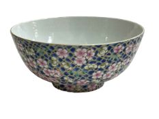 Chinese bowl with profuse blossom on blue ground decoration, four character mark, 14cm diameter.