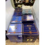 Eight boxed Bells Scotch Whisky decanters.