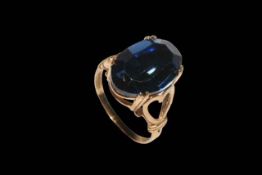 9 carat gold blue stone dress ring.