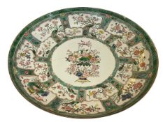 Large antique Chinese famille verte plaque with foliate decoration, 45.5cm diameter.