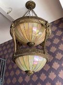 Massive centre light fitting with two tiers of lighting with winged maiden supports,