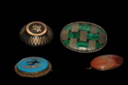 Four brooches including agate and malachite.