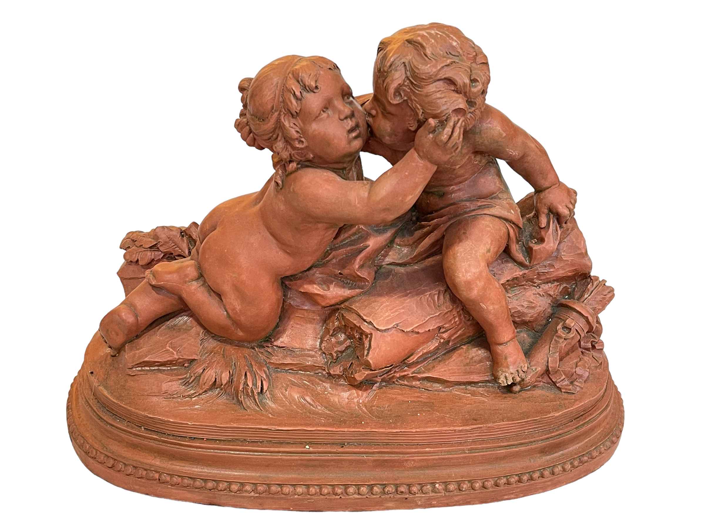 Terracotta group of two putti, signed Cholin.