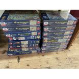 Sixteen Jan Van Haasteren jigsaw puzzles.