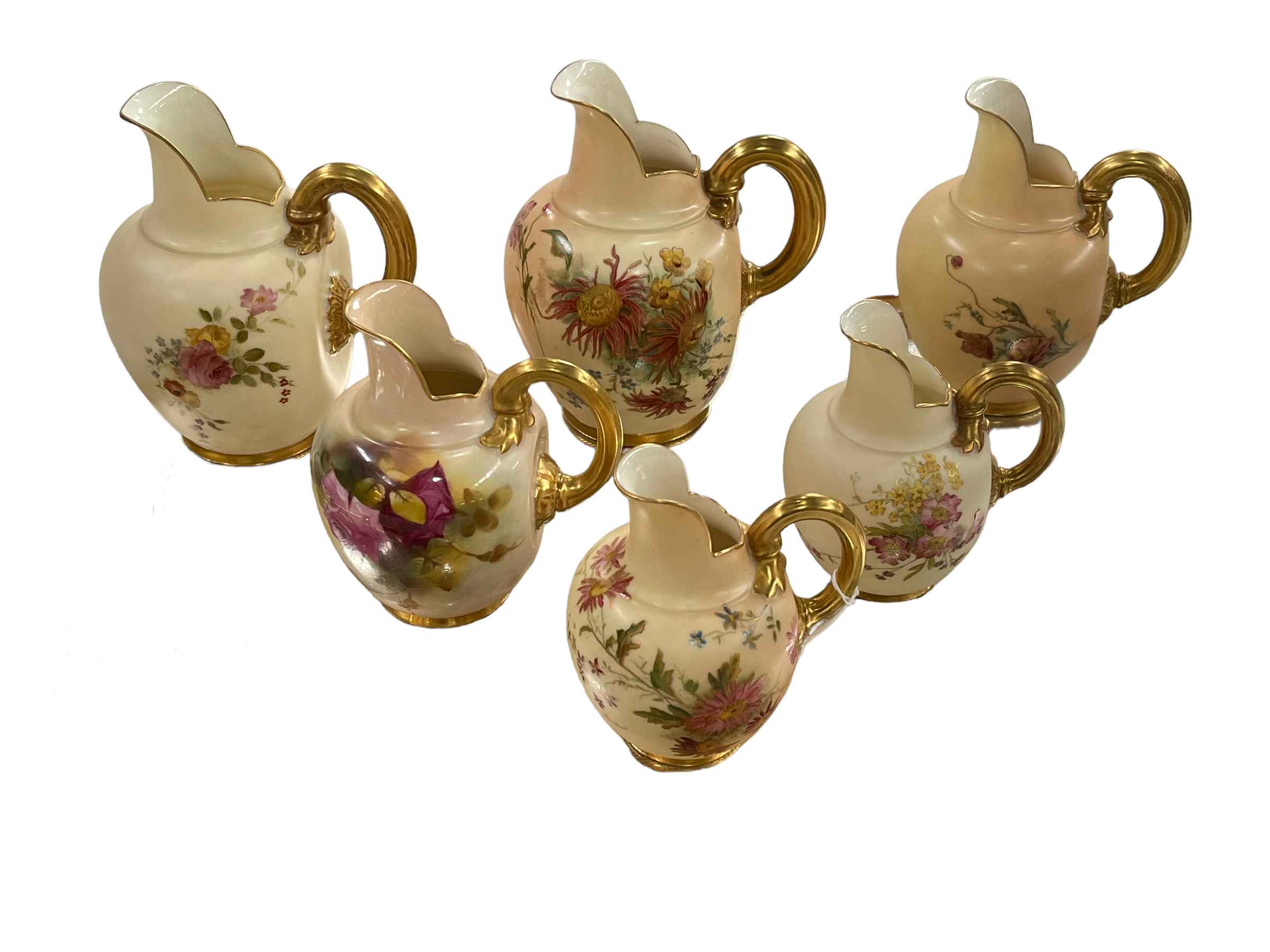 Six Royal Worcester blush ware flat backed jugs.