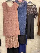 Collection of ladies vintage lace work evening gowns.