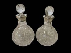 Pair of silver mounted crystal bottles, 19cm.