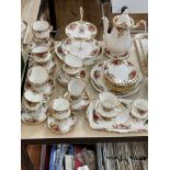 Royal Albert Country Roses china with coffee pot and cake stand, 50 pieces.