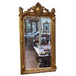 Large ornate gilt framed bevelled wall mirror mounted to each corner with winged cherubs,