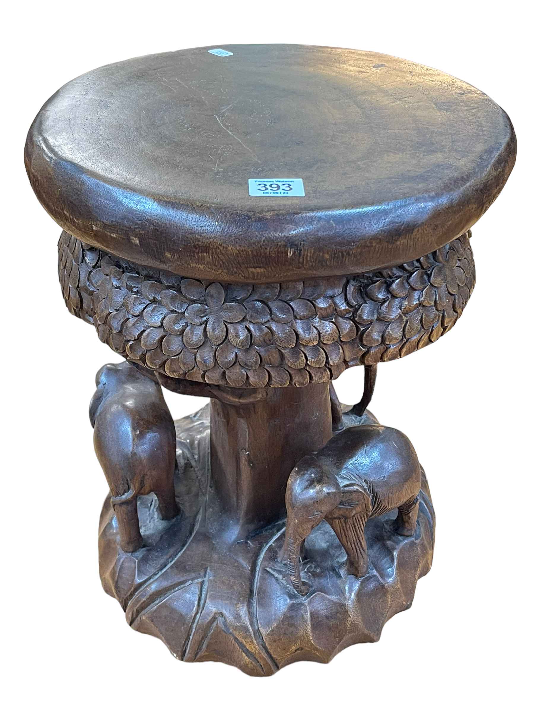 Solid carved wood elephant stool, 41cm high.